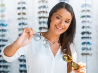 Woman looking at sunglasses